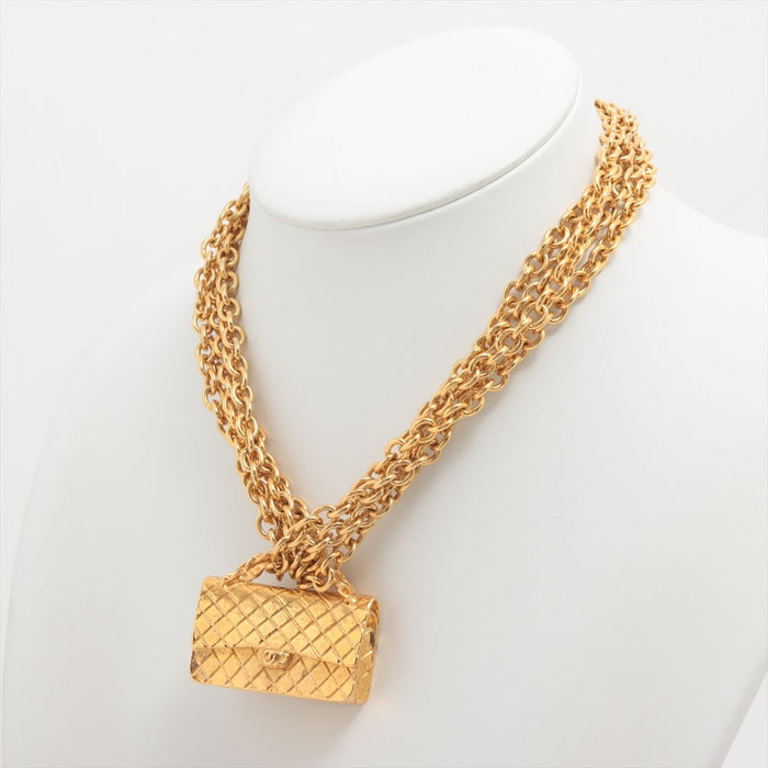 Chanel
Gold Metal Quilted Flap Bag Multi-Chain Necklace