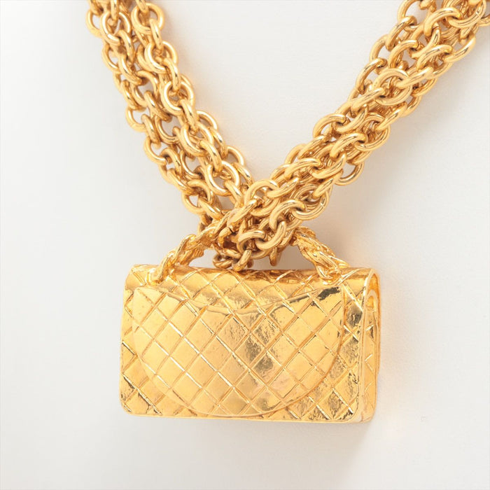 Chanel
Gold Metal Quilted Flap Bag Multi-Chain Necklace